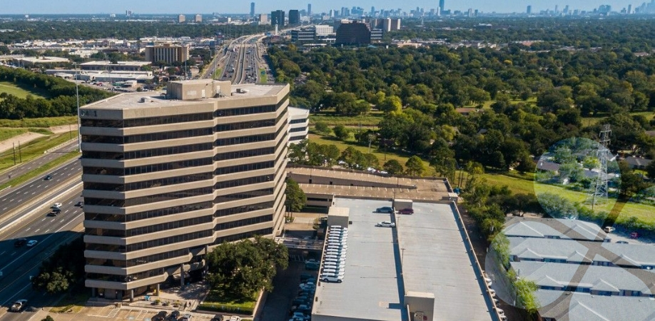 Case Study Hero Image: Drone/helicopter view of The Harris Center HQ and downtown Houston in the distance